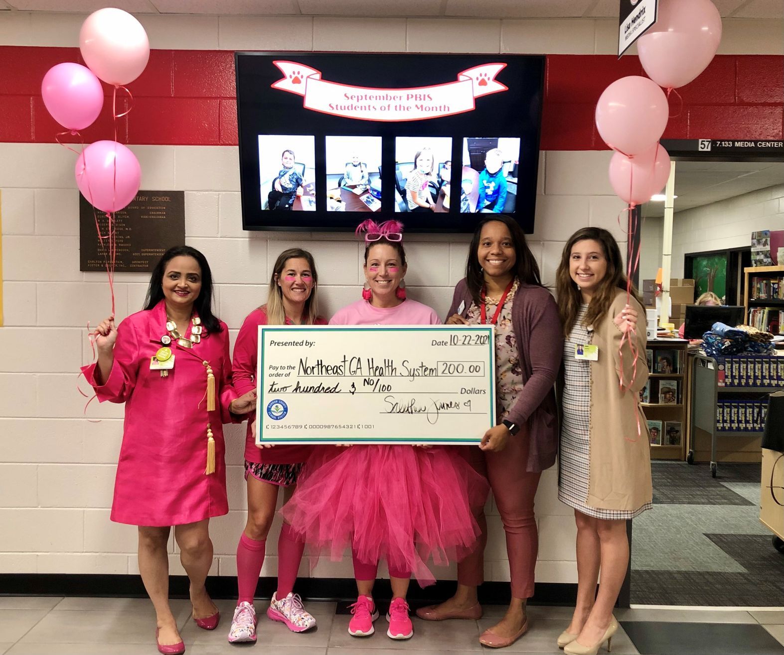 Statham Elementary holds ‘Pink Out Day,’ makes donation to NGHS Foundation